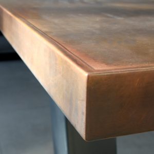Aged copper table with edge finish